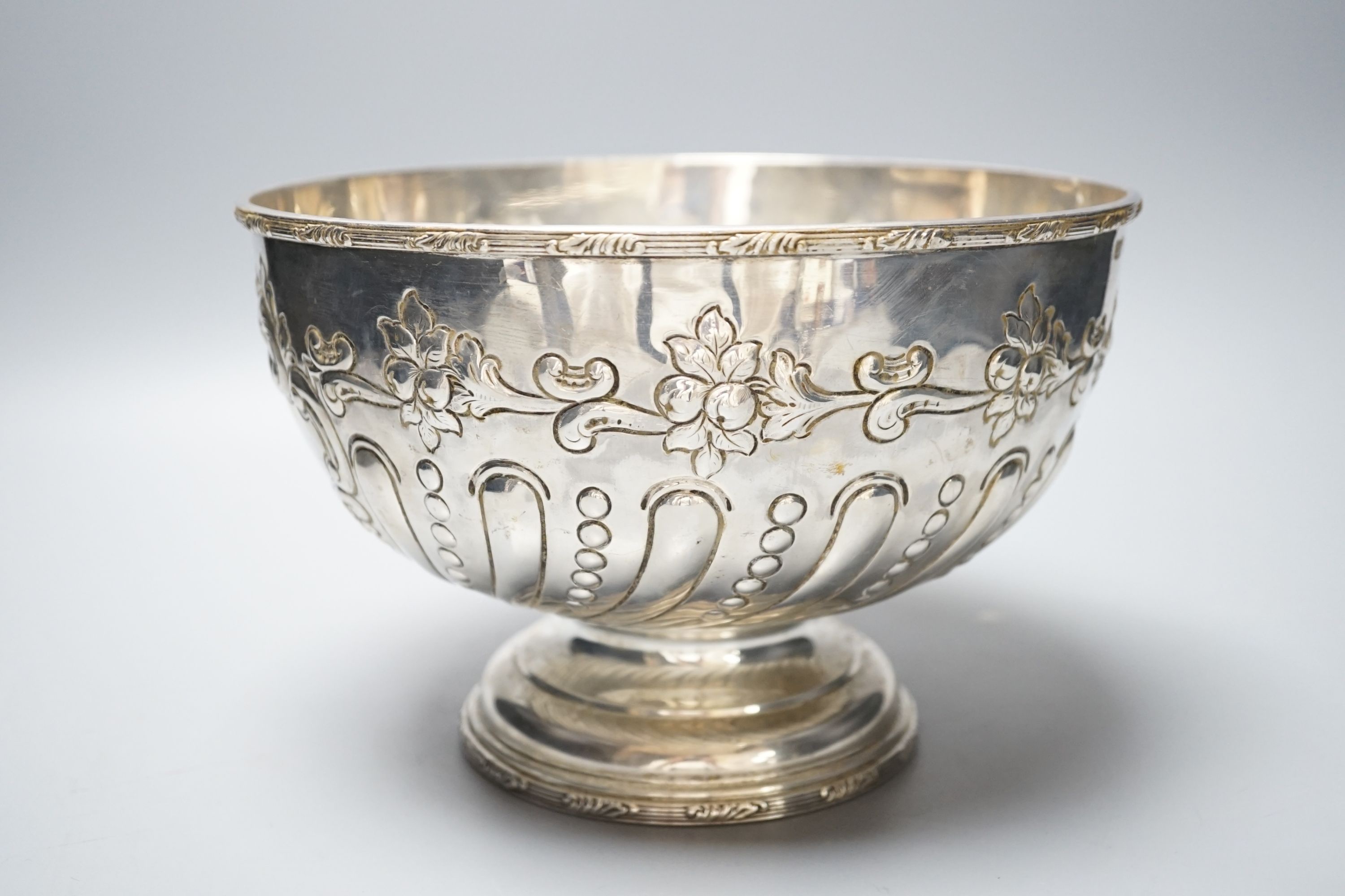 A George V embossed silver rose bowl, with later engraved inscription, Daniel & Arter, Birmingham, 1911, 22.5cm, 25oz.